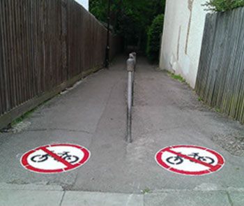 Custom floor markings, hard wearing & long lasting. Painted at entrance to Queens Wood.